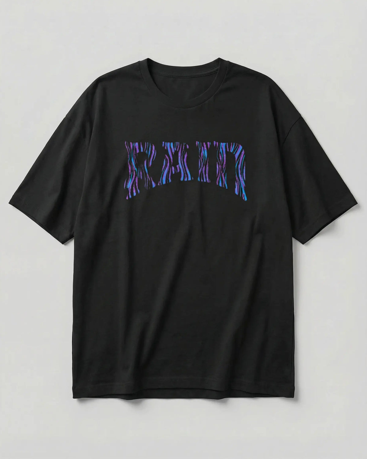 A black short-sleeve crewneck t-shirt featuring a stylized 'RATM' graphic across the chest in a purple and blue zebra-like pattern, displayed against a neutral light gray background.