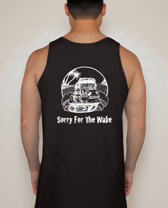 A man wearing a black tank top with a white graphic of a speedboat on water with palm trees and the text 'Sorry For The Wake' printed on the back.